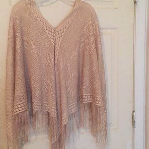 A golden Shaw/poncho.